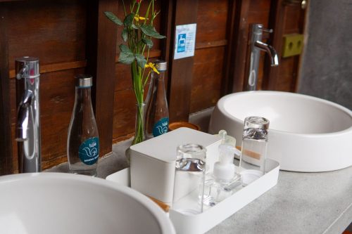 Twin basins with mineral water and amenities