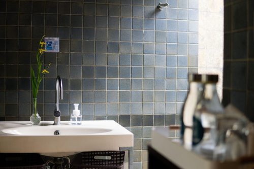 Bathroom basin with fresh flowers